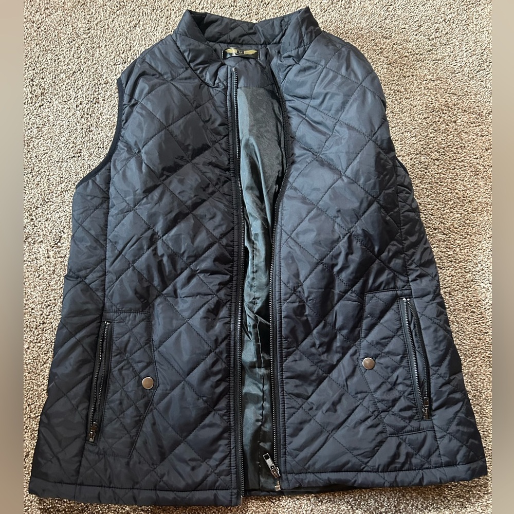 Plain black vest, good condition and good to some what stay warm!